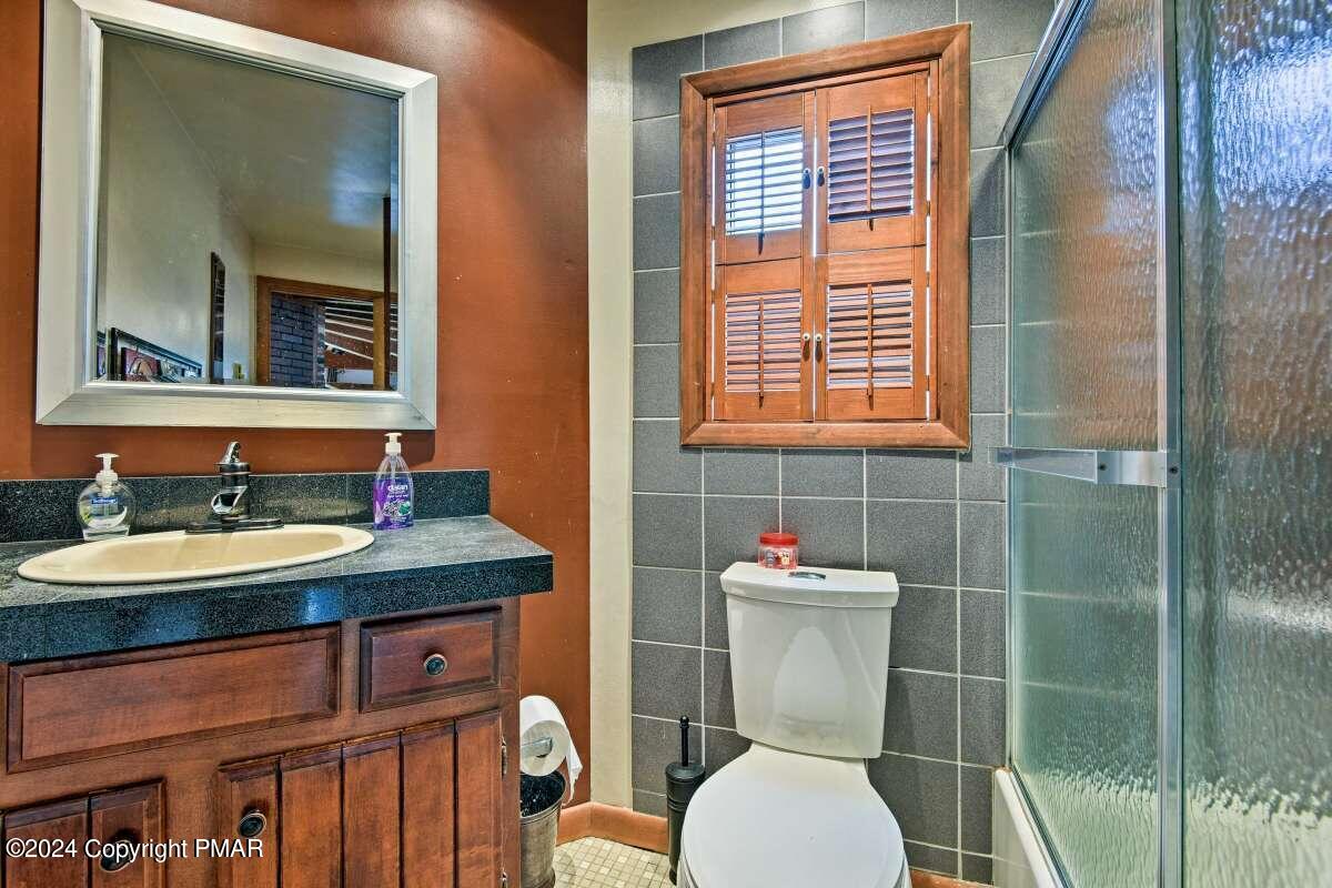 122 Elgin Way Bushkill, PA 18324 - Photo 15 of 32 a bathroom with a toilet sink and mirror