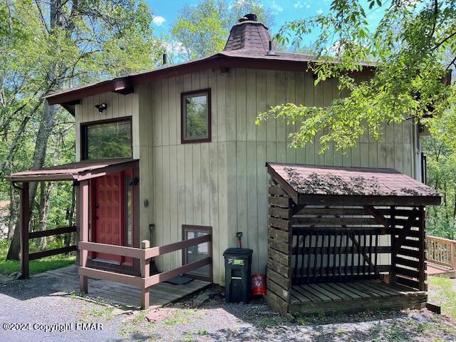 122 Elgin Way Bushkill, PA 18324 - Photo 22 of 32 a view of a patio with a table chairs and a fire pit