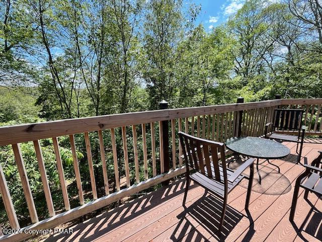 122 Elgin Way Bushkill, PA 18324 - Photo 29 of 32 a view of a balcony with wooden floor and outdoor seating