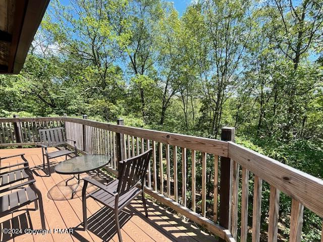 122 Elgin Way Bushkill, PA 18324 - Photo 30 of 32 a view of balcony with wooden floor and outdoor seating