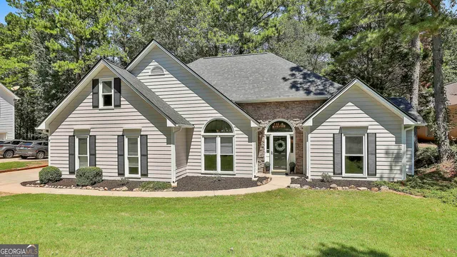 a front view of a house with a yard