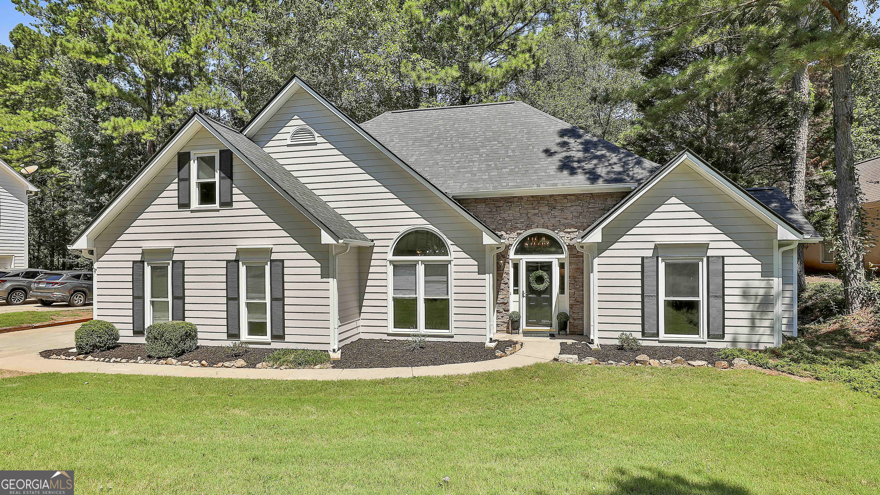 a front view of a house with a yard