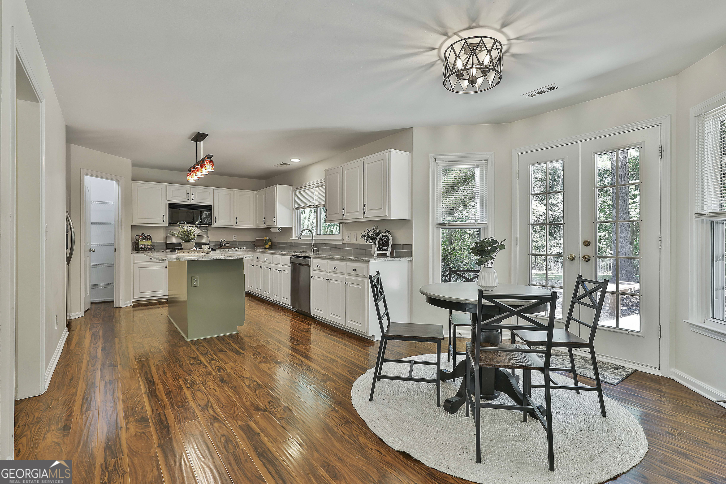 244 Terrane Ridge Peachtree City, GA 30269 - Photo 12 of 44 a view of a dining room with furniture kitchen and wooden floor