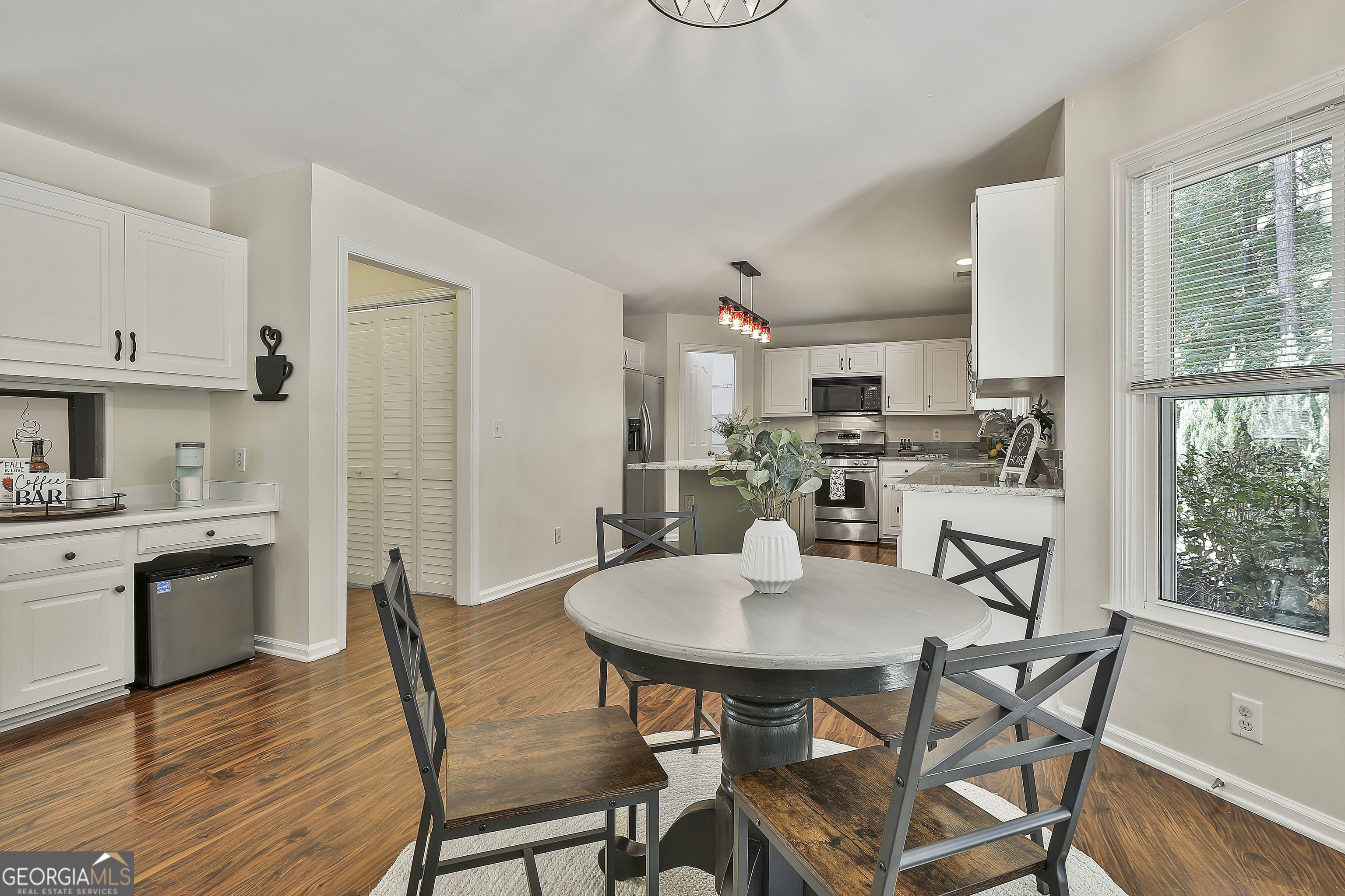 244 Terrane Ridge Peachtree City, GA 30269 - Photo 13 of 44 a view of a dining room with furniture wooden floor and a window