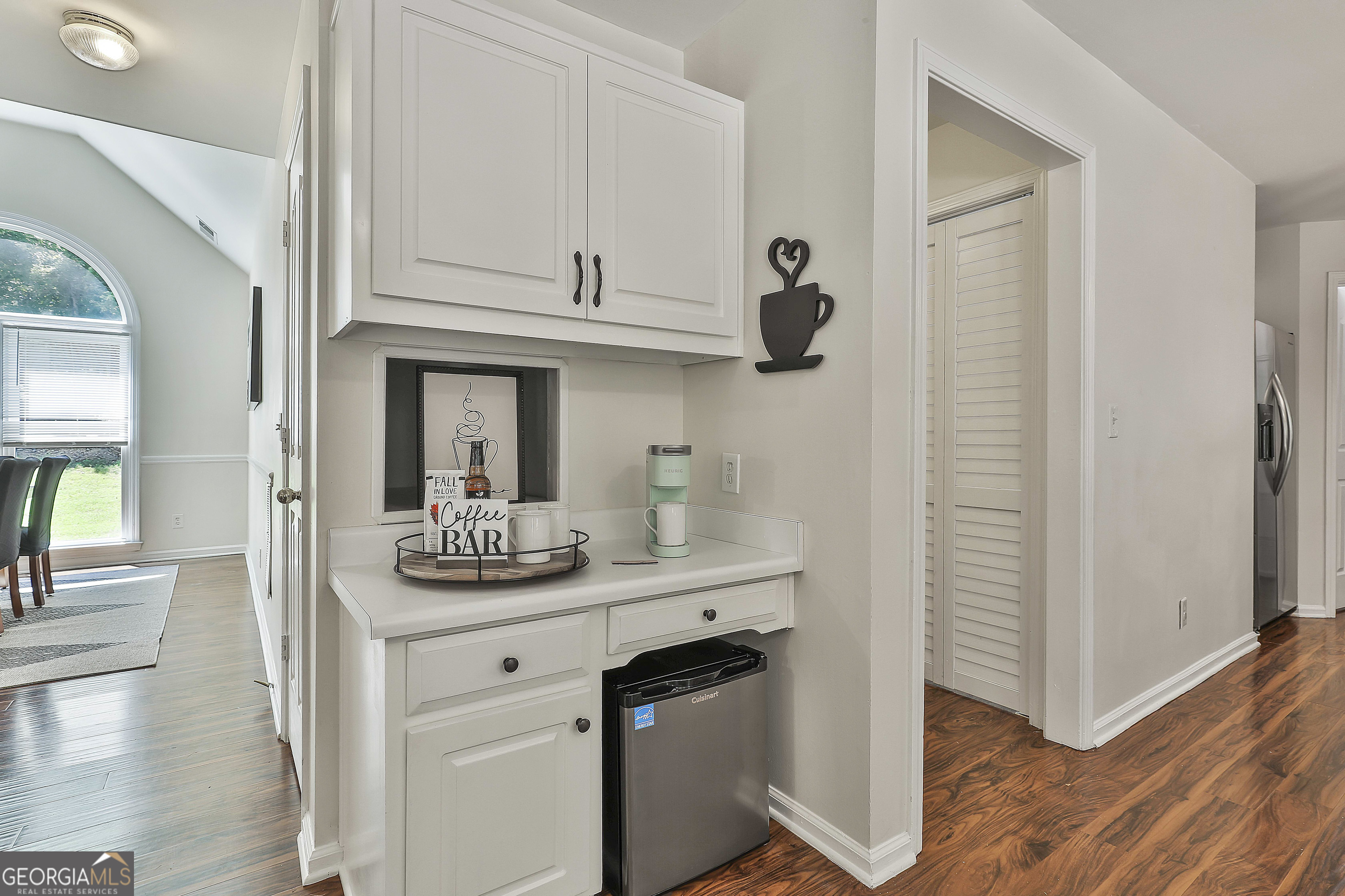 244 Terrane Ridge Peachtree City, GA 30269 - Photo 14 of 44 a kitchen with stainless steel appliances granite countertop a sink and dishwasher with wooden floor