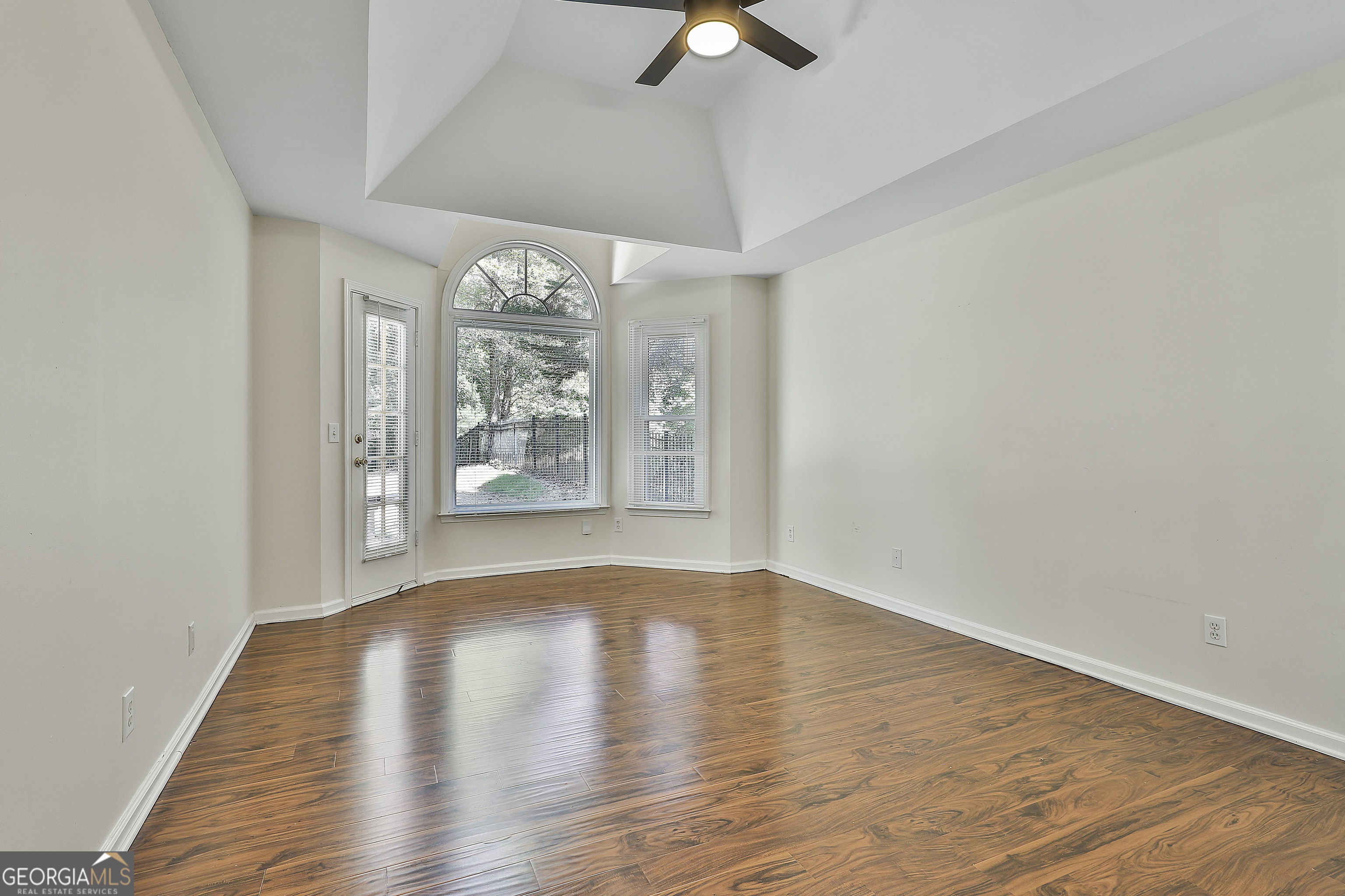 244 Terrane Ridge Peachtree City, GA 30269 - Photo 19 of 44 wooden floor in an empty room with a window