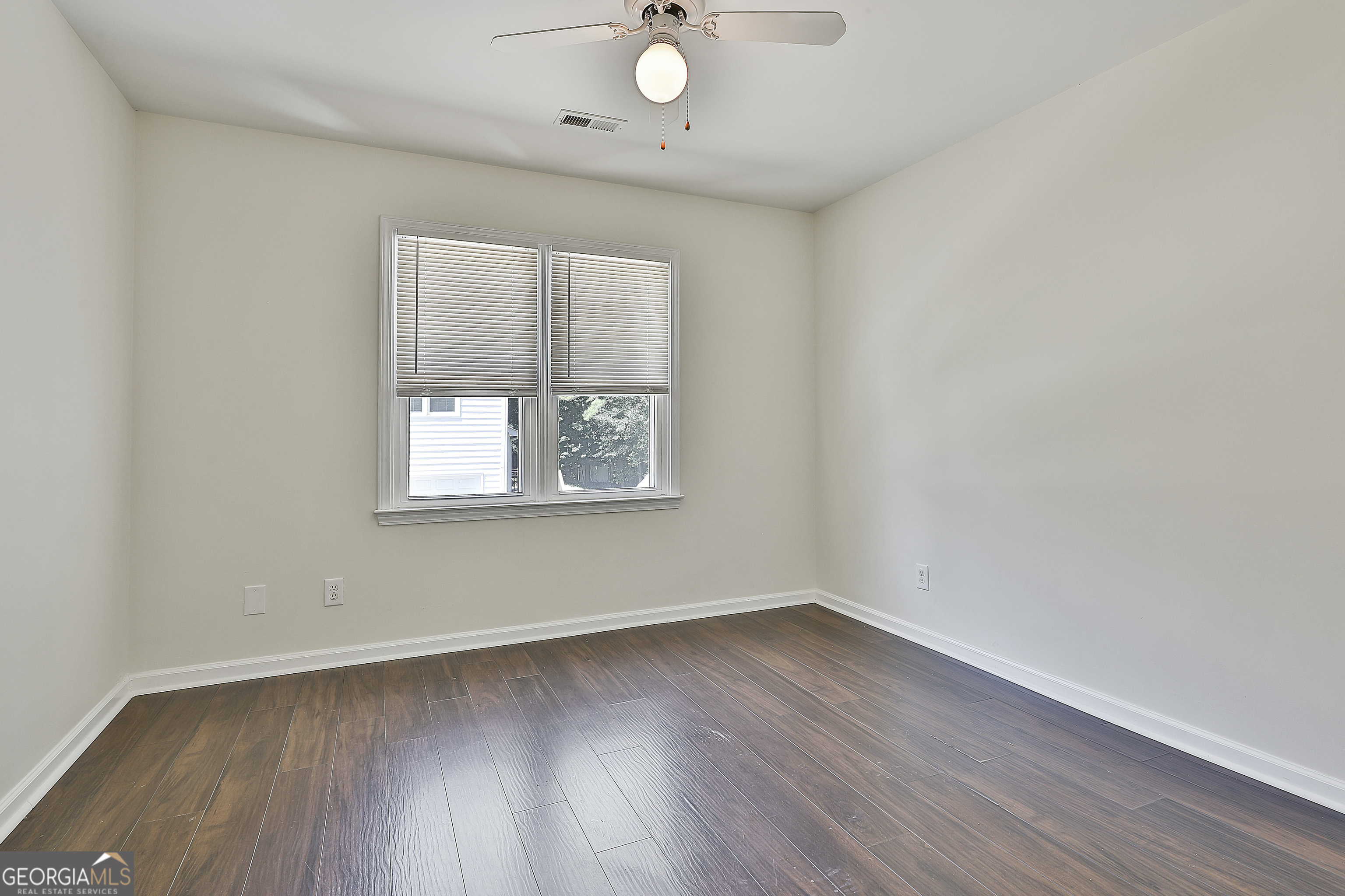 244 Terrane Ridge Peachtree City, GA 30269 - Photo 26 of 44 an empty room with wooden floor and windows