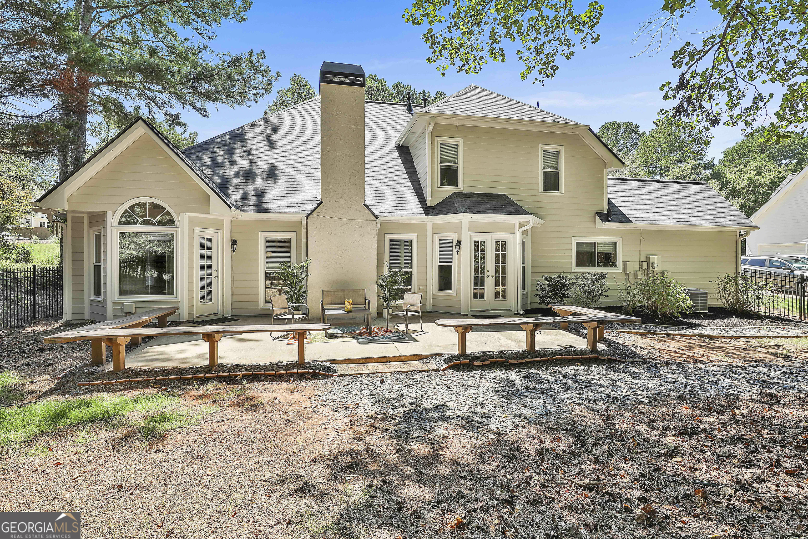 244 Terrane Ridge Peachtree City, GA 30269 - Photo 30 of 44 a view of a white house with a yard and sitting area