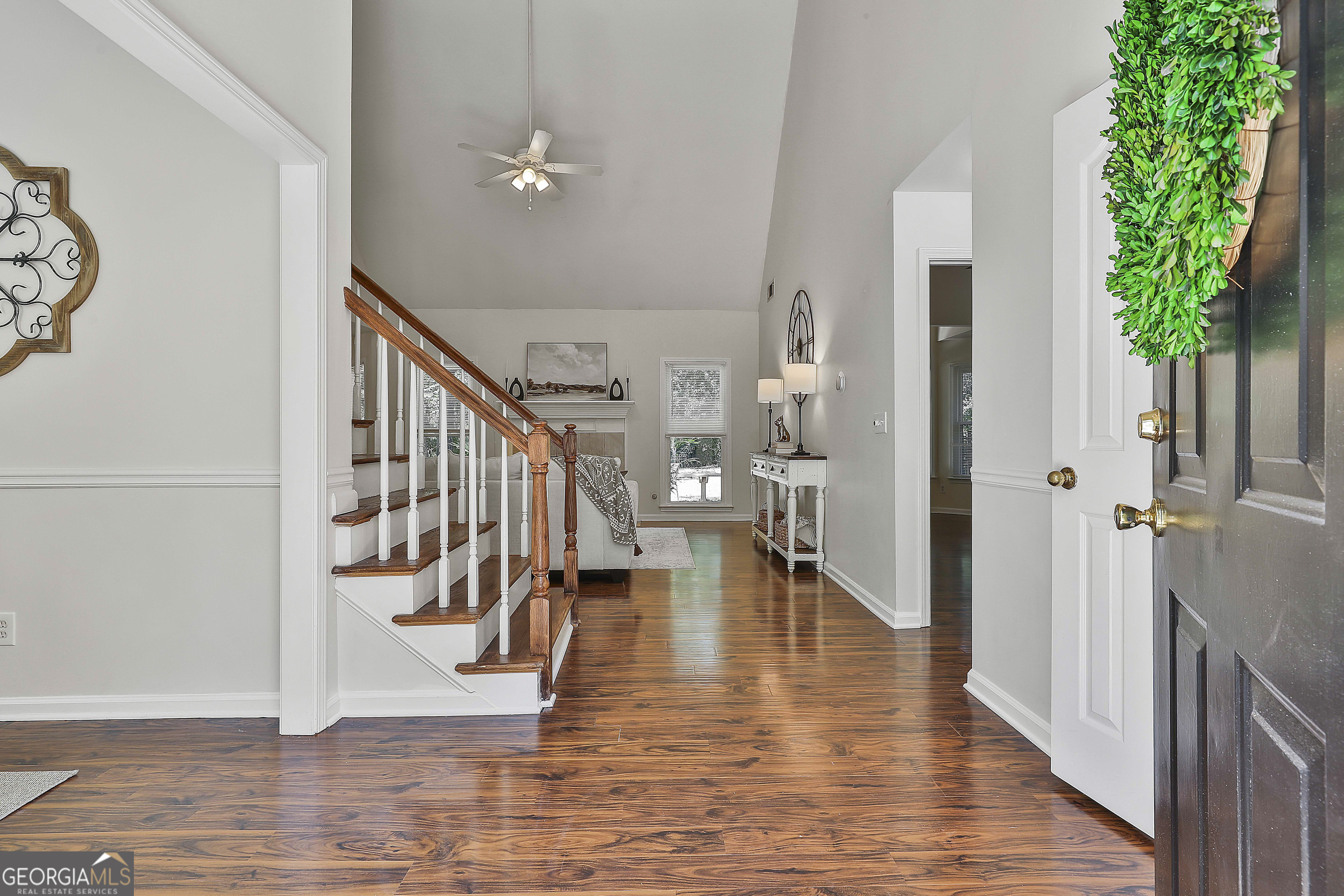 244 Terrane Ridge Peachtree City, GA 30269 - Photo 3 of 44 a view of an entryway with wooden floor and a livingroom view