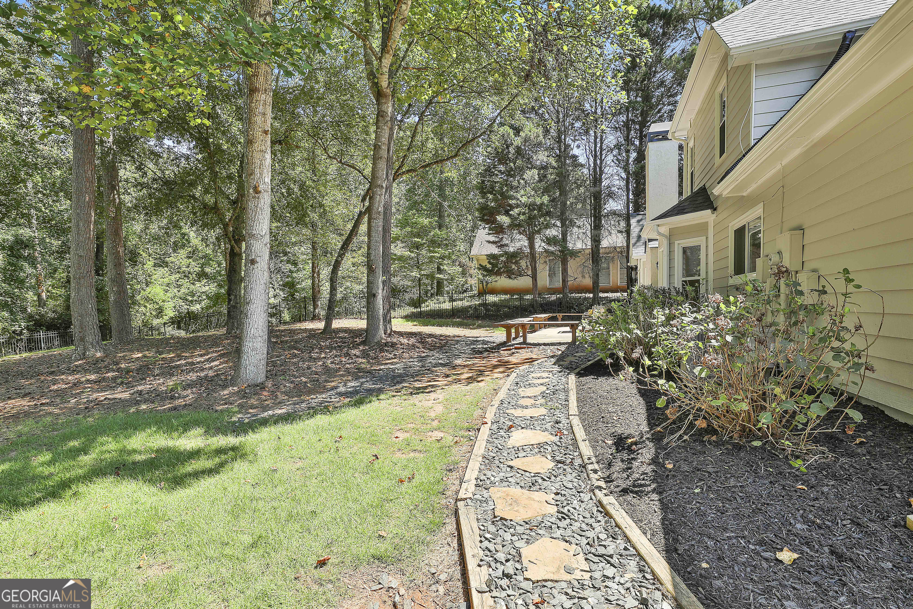 244 Terrane Ridge Peachtree City, GA 30269 - Photo 32 of 44 a view of a yard with plants and trees