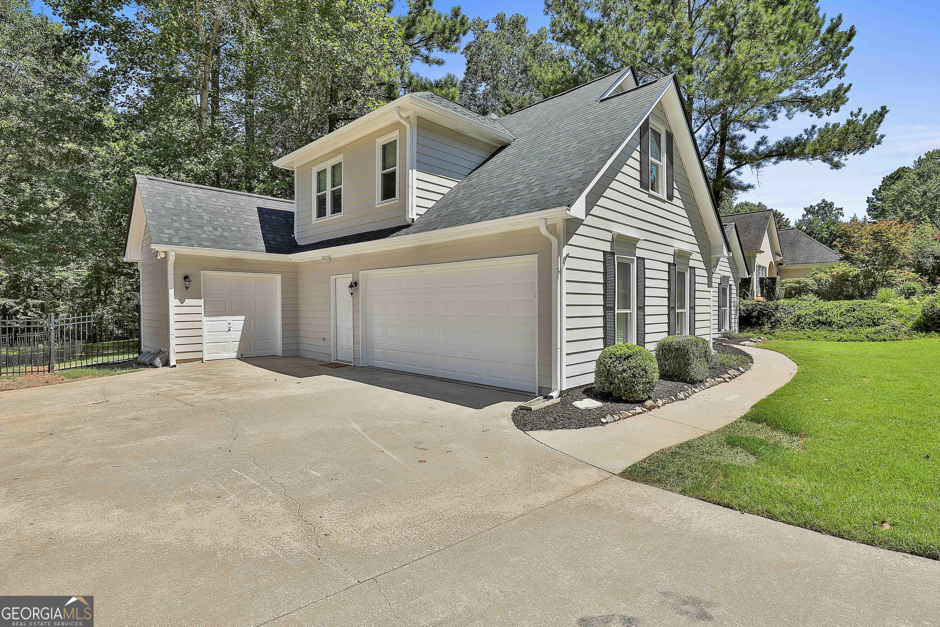 244 Terrane Ridge Peachtree City, GA 30269 - Photo 34 of 44 a view of a house with a yard and potted plants