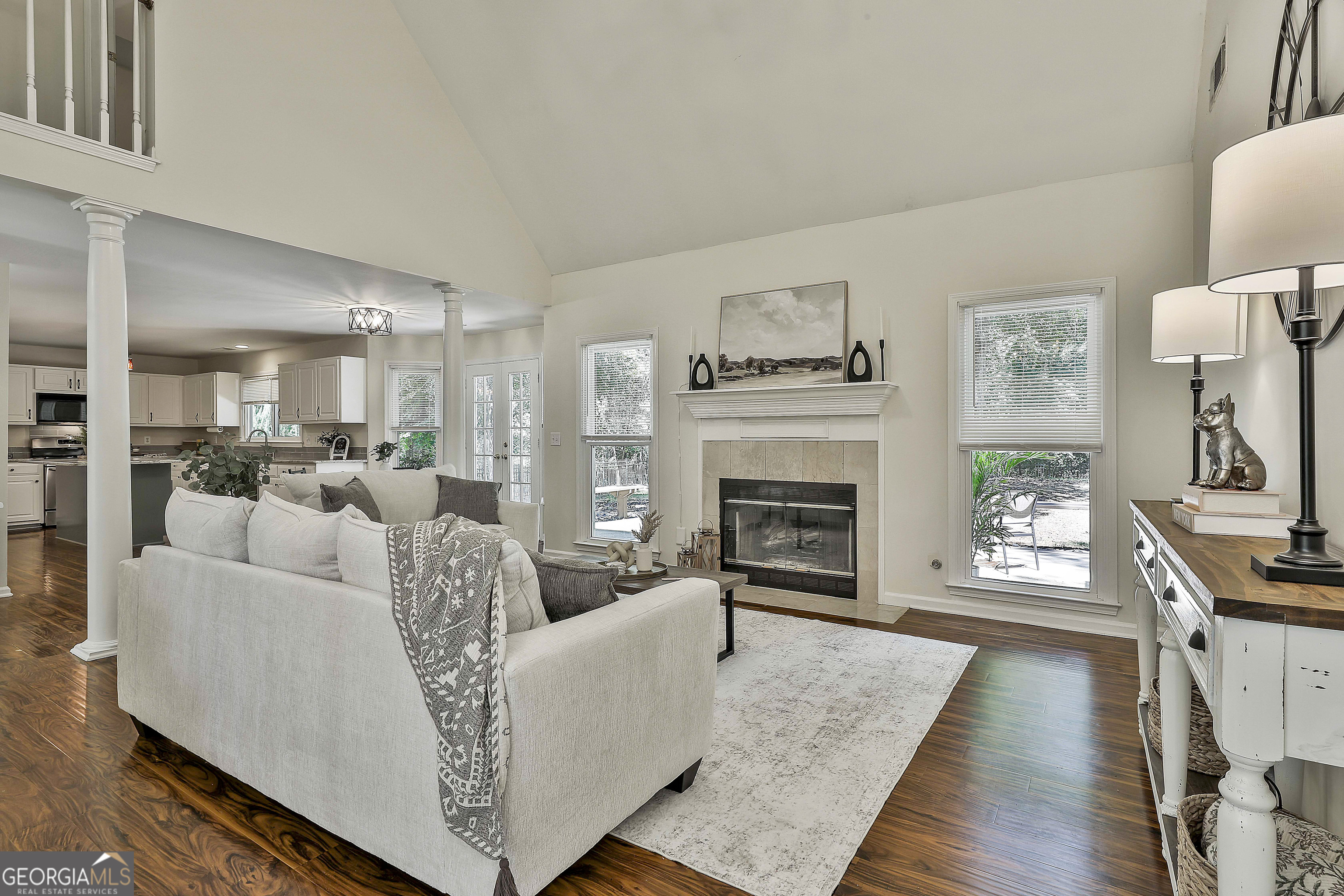 244 Terrane Ridge Peachtree City, GA 30269 - Photo 8 of 44 a living room with furniture a fireplace and a flat screen tv
