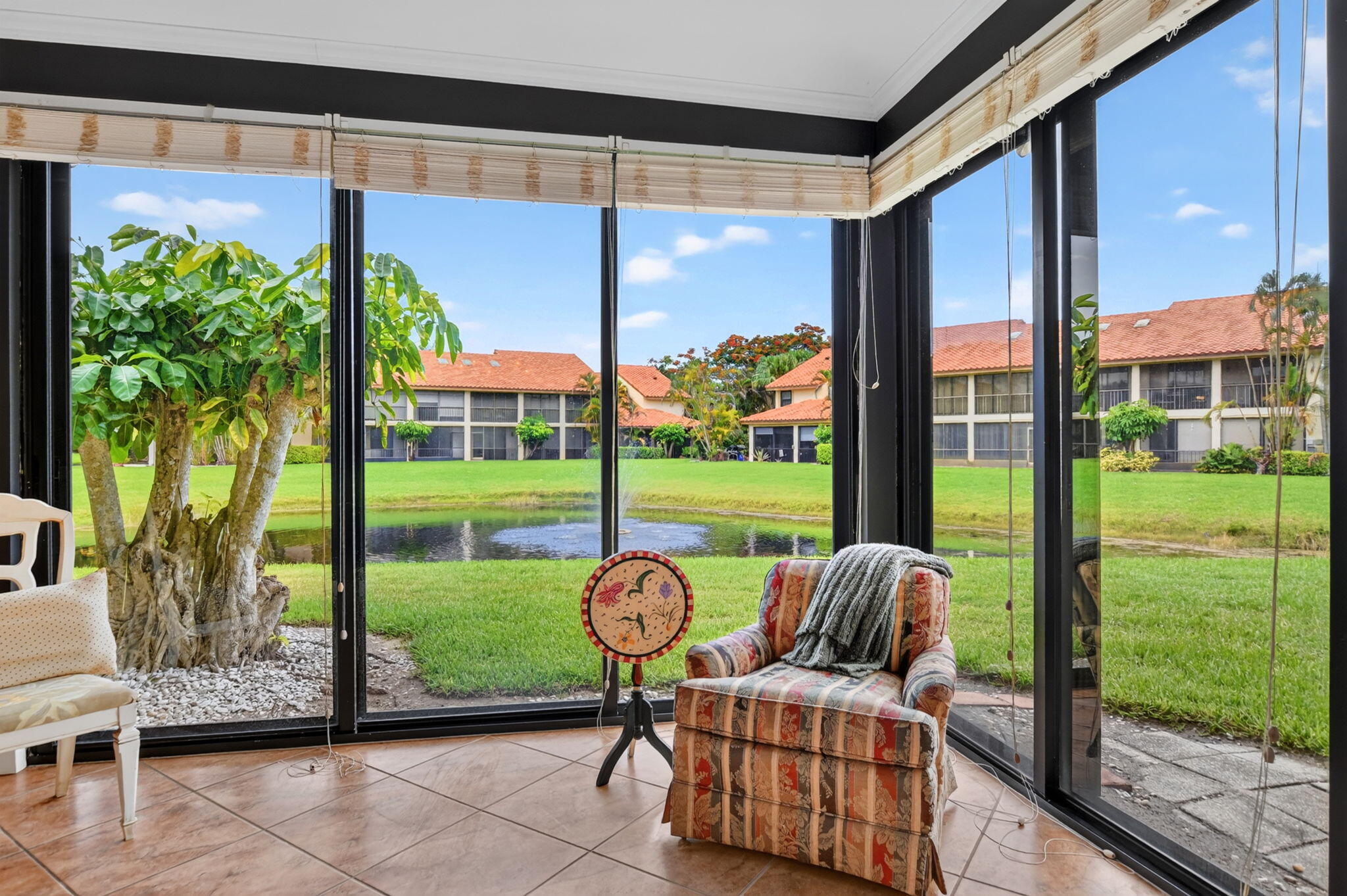 7913 La Mirada Drive Boca Raton, FL 33433 - Photo 17 of 67 Enclosed patio and lake views