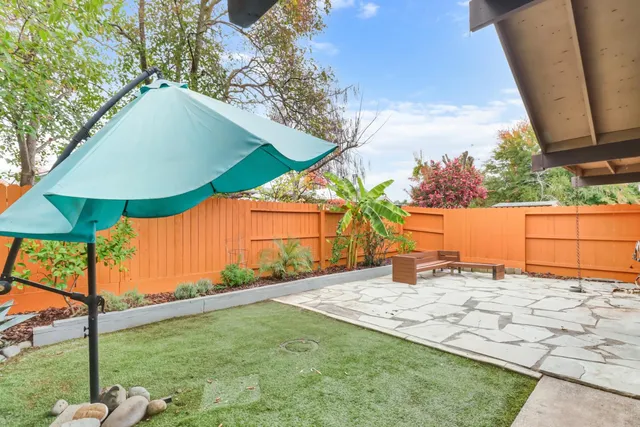 a backyard of a house with lots of green space