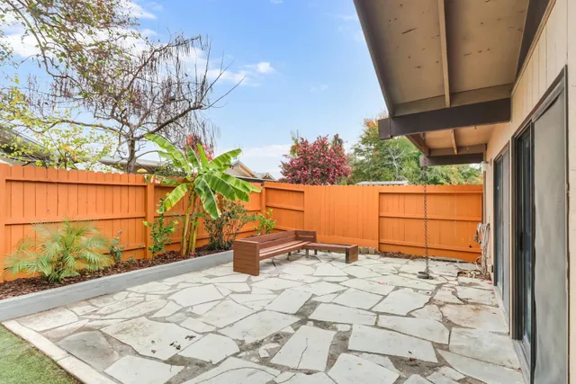 a view of a backyard of the house