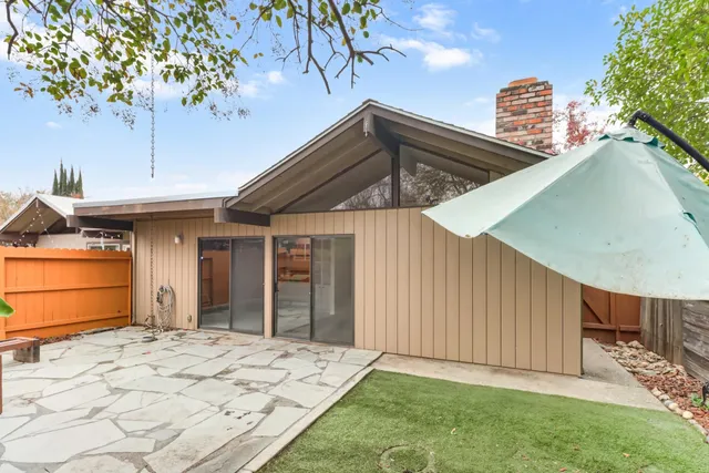 a house view with a backyard space