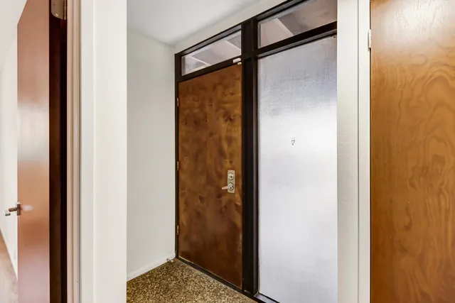 a bathroom with a glass shower door