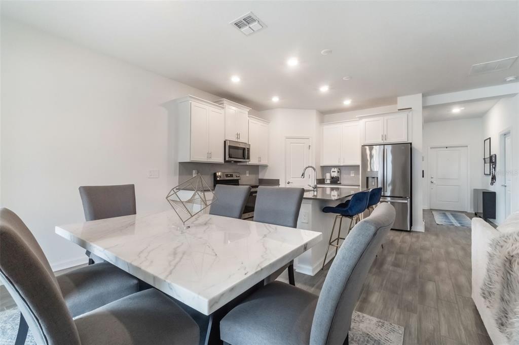 2747 Slash Way St. Cloud, FL 34771 - Photo 13 of 62 a view of kitchen with cabinets table and chairs