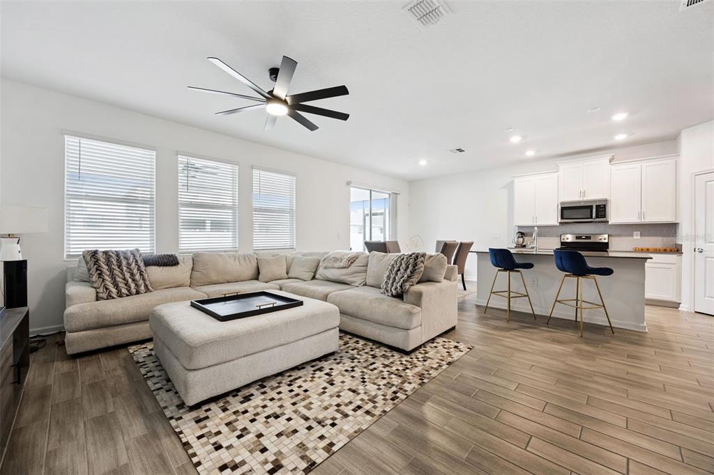 2747 Slash Way St. Cloud, FL 34771 - Photo 17 of 62 a living room with furniture and a large window