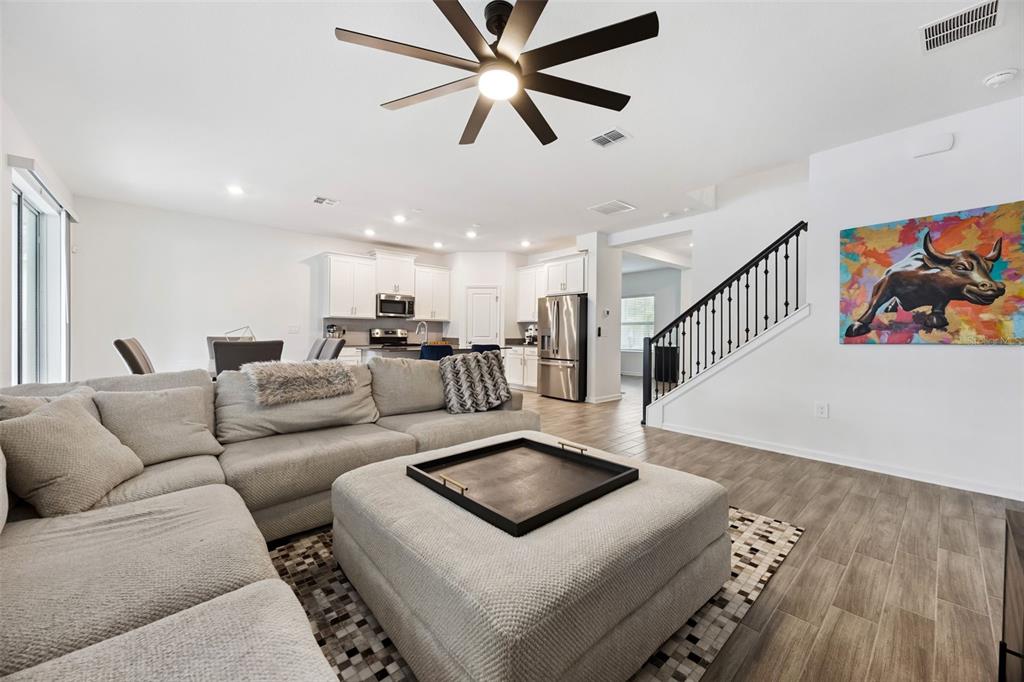 2747 Slash Way St. Cloud, FL 34771 - Photo 18 of 62 a living room with furniture and a ceiling fan