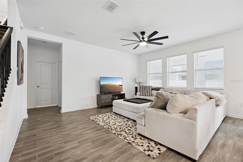 2747 Slash Way St. Cloud, FL 34771 - Photo 19 of 62 a living room with furniture and a large window