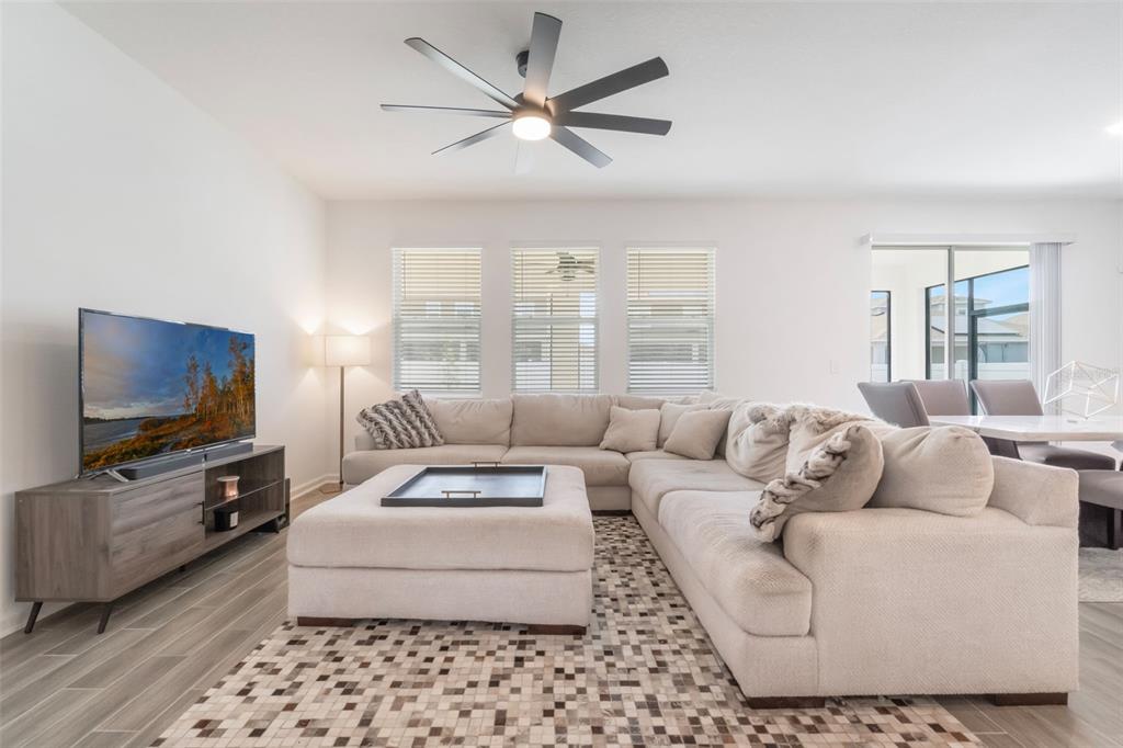 2747 Slash Way St. Cloud, FL 34771 - Photo 20 of 62 a living room with furniture and a flat screen tv