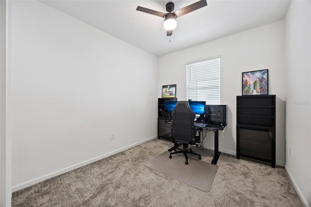 2747 Slash Way St. Cloud, FL 34771 - Photo 21 of 62 a view of a workspace with furniture and a window