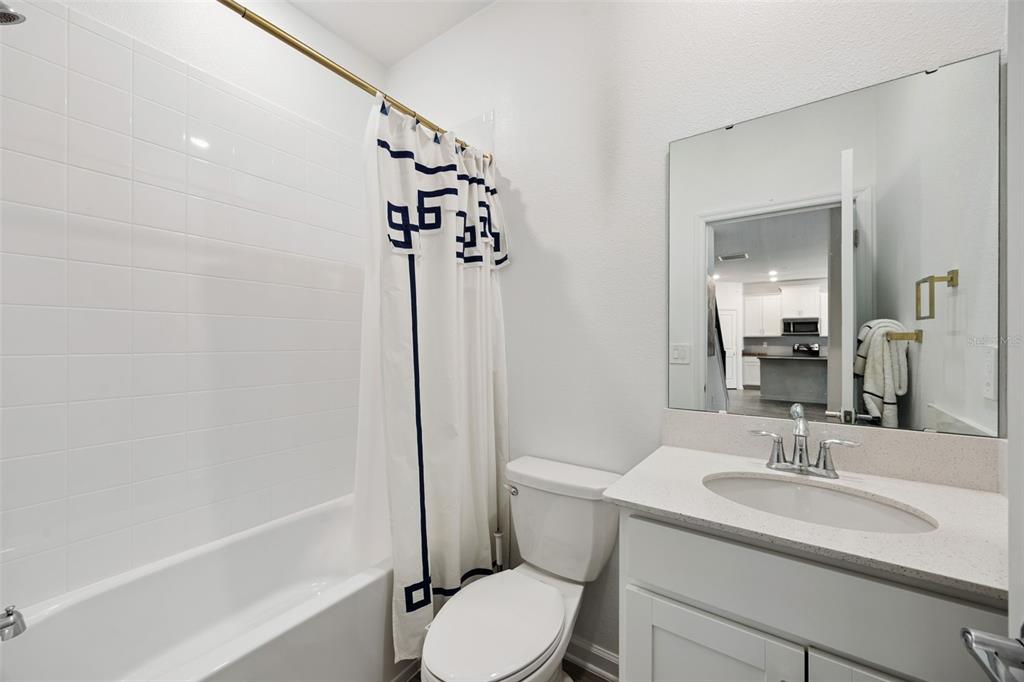 2747 Slash Way St. Cloud, FL 34771 - Photo 23 of 62 a bathroom with a sink toilet and shower