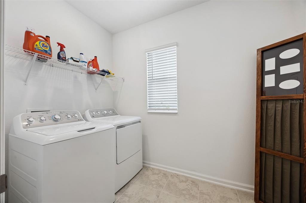 2747 Slash Way St. Cloud, FL 34771 - Photo 25 of 62 a utility room with dryer and washer