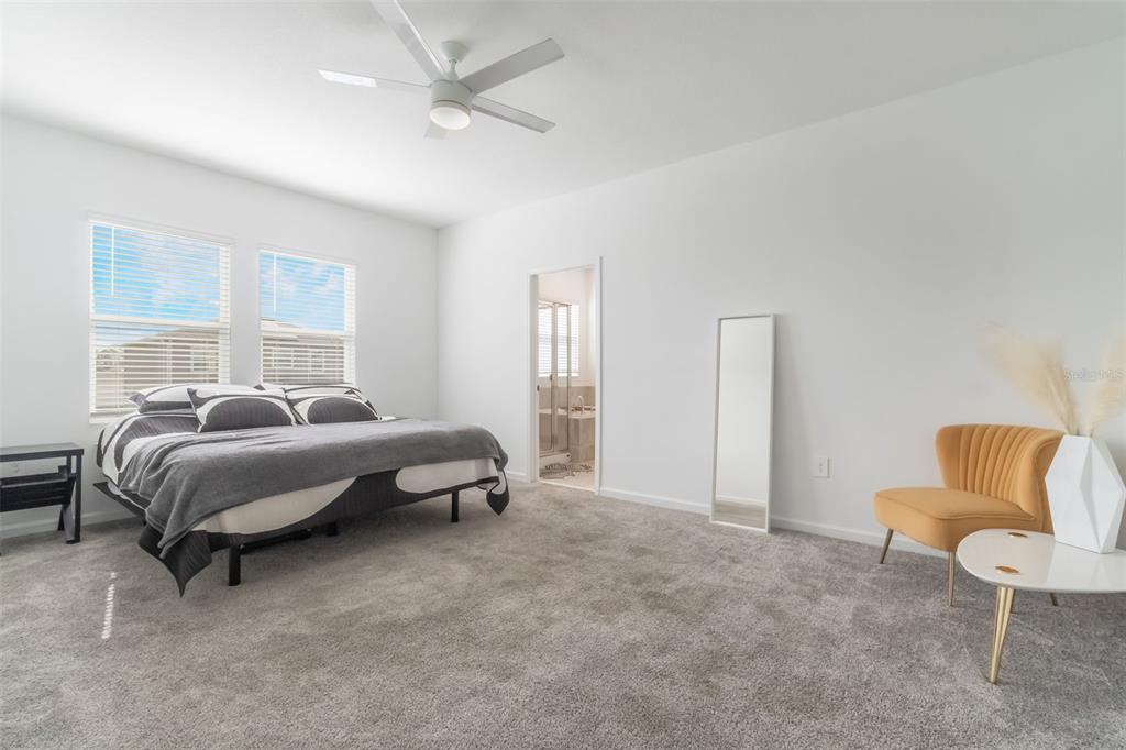 2747 Slash Way St. Cloud, FL 34771 - Photo 28 of 62 a bedroom with a bed and chair