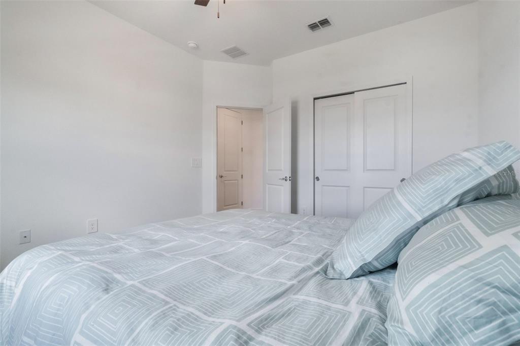 2747 Slash Way St. Cloud, FL 34771 - Photo 36 of 62 a view of a bedroom with a bed and a shower