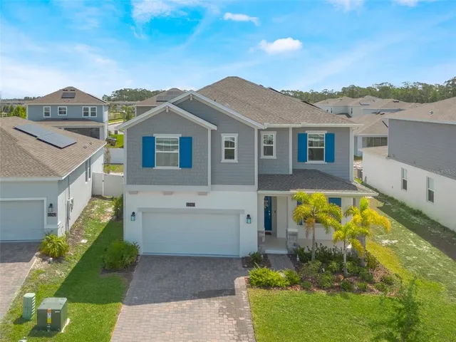 a view of house with a swimming pool