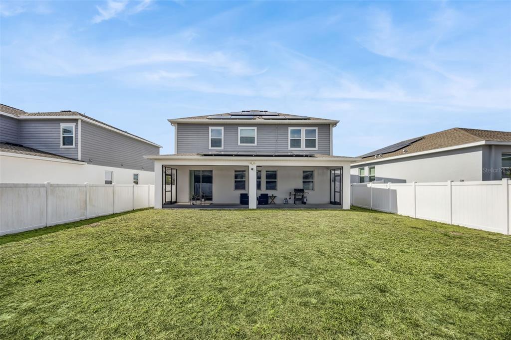 2747 Slash Way St. Cloud, FL 34771 - Photo 44 of 62 a front view of a house with a yard