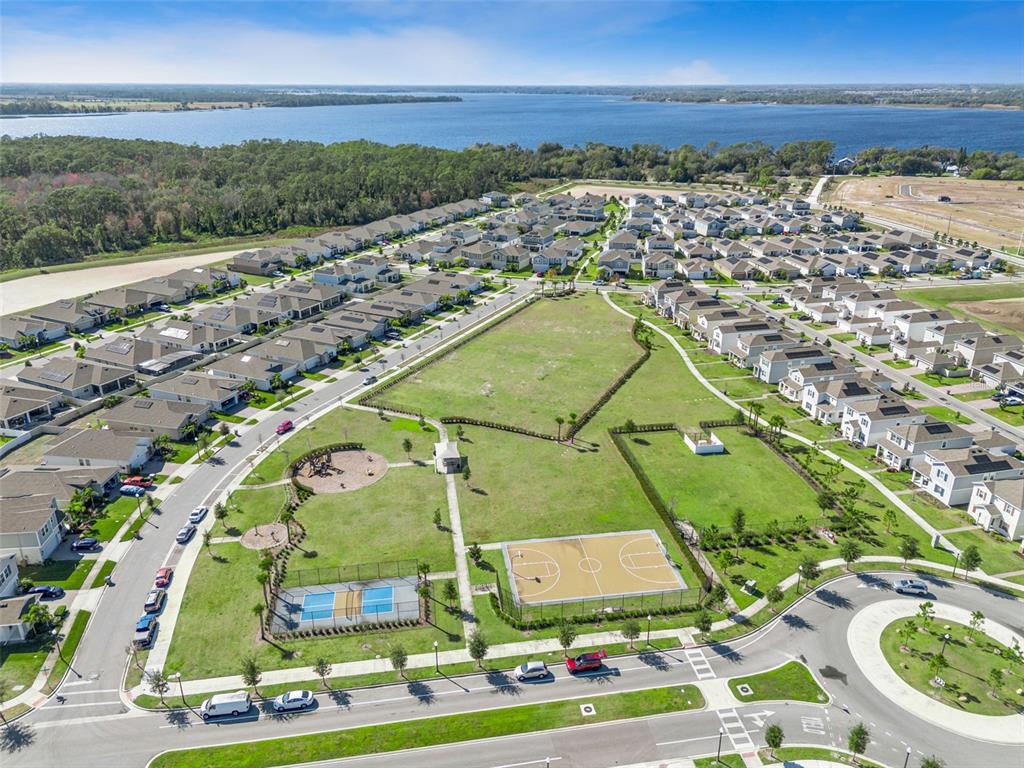 2747 Slash Way St. Cloud, FL 34771 - Photo 52 of 62 an aerial view of residential building and lake