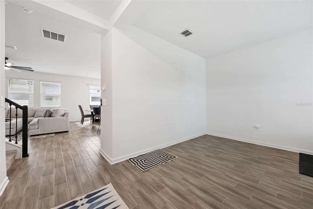 2747 Slash Way St. Cloud, FL 34771 - Photo 9 of 62 a view of a livingroom with wooden floor and furniture