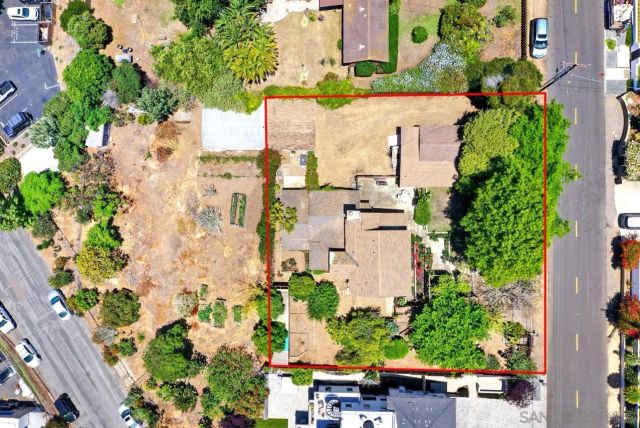 an aerial view of multiple house with yard