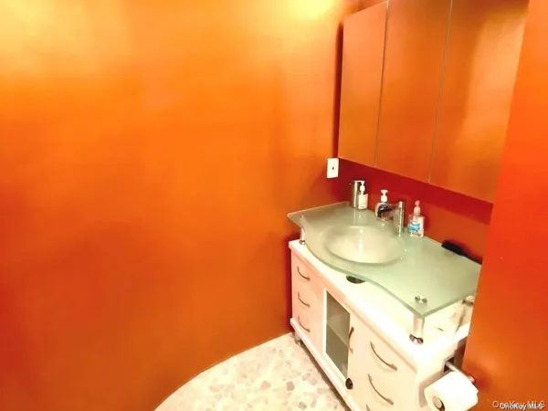 a bathroom with a tub and shower