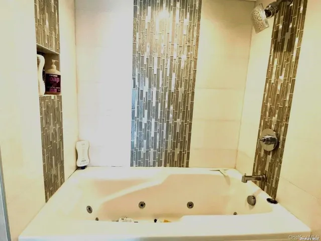 a view of a hallway with furniture