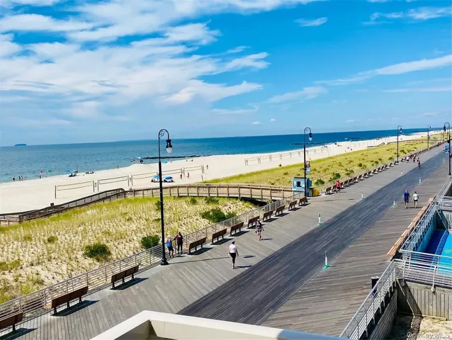 a view of a dining room with furniture and a window