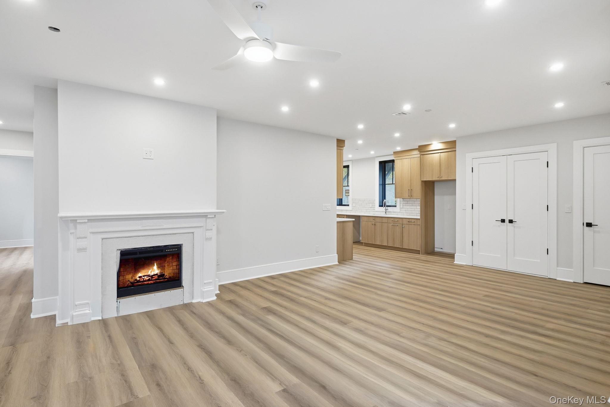 34 Clinton Avenue, Unit 9 Dobbs Ferry, NY 10522 - Photo 2 of 13 a view of an empty room with a fireplace