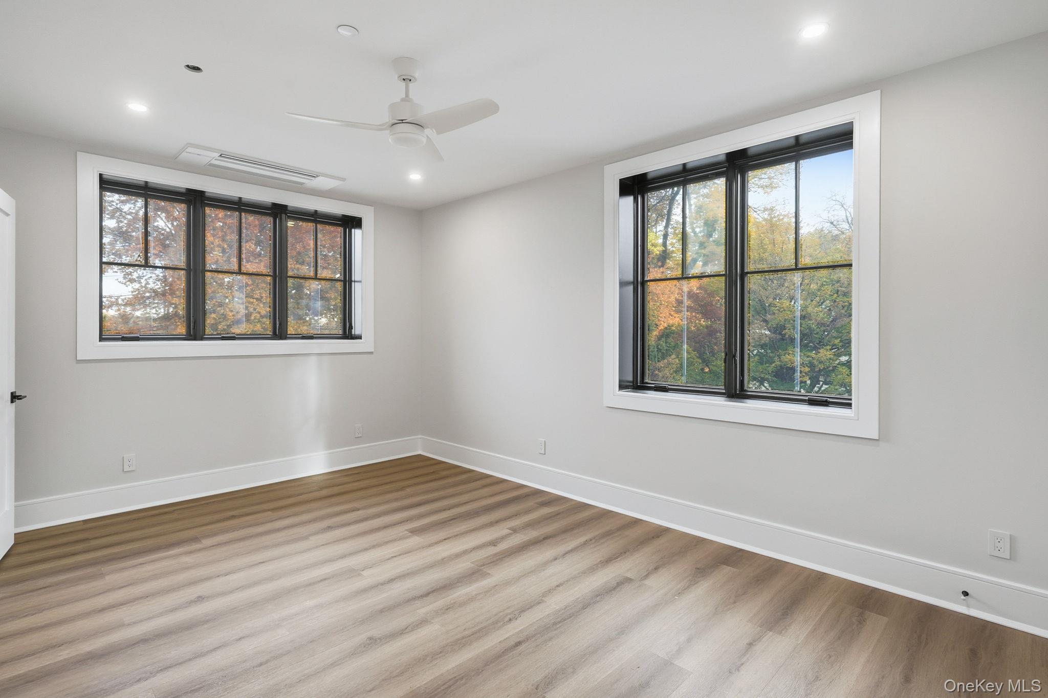 34 Clinton Avenue, Unit 9 Dobbs Ferry, NY 10522 - Photo 8 of 13 a view of an empty room with wooden floor and a window