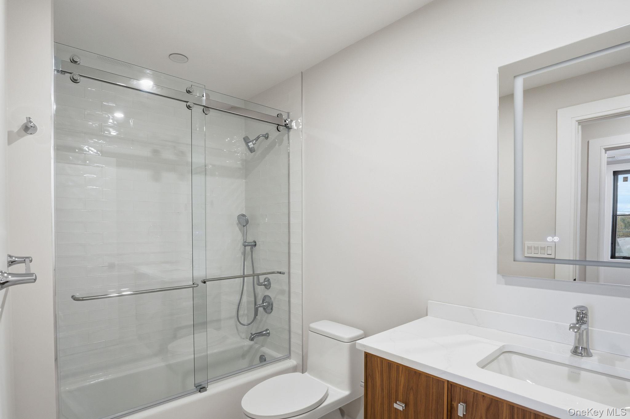 34 Clinton Avenue, Unit 9 Dobbs Ferry, NY 10522 - Photo 9 of 13 a bathroom with a sink toilet and shower