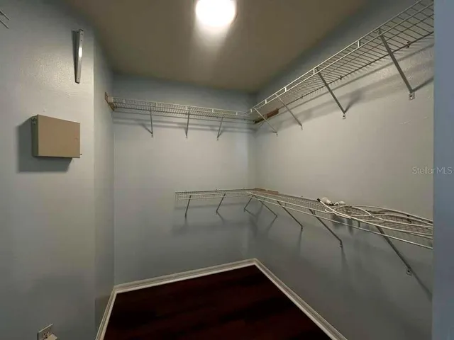 a kitchen with granite countertop a stove a sink and a window