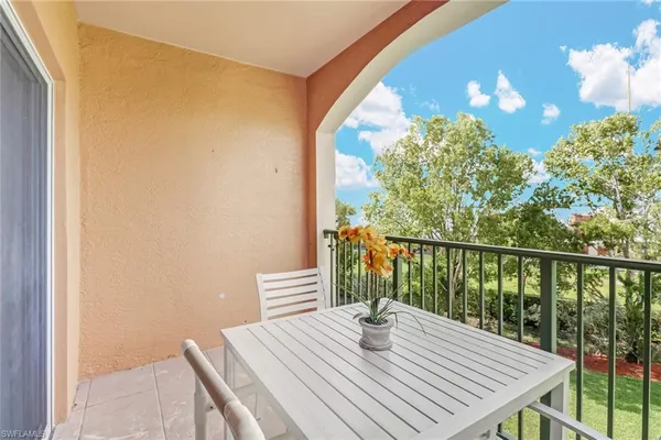 a balcony with wooden floor