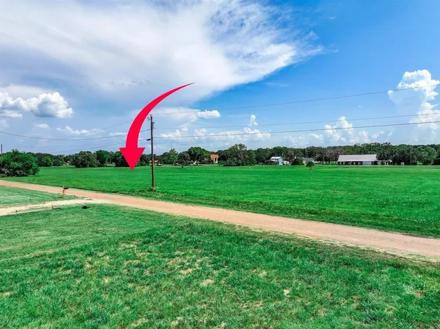 a view of a golf course with a swimming pool