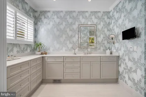 a kitchen with granite countertop a sink and cabinets