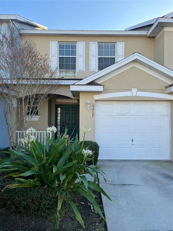 6407 Barksdale Way Riverview, FL 33578 - Photo 1 of 18 a view of a house with a plants and a garage