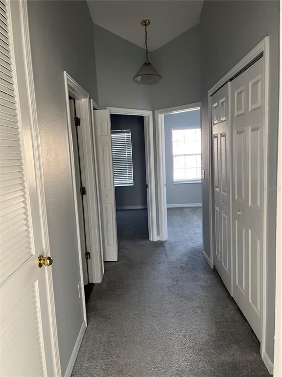 6407 Barksdale Way Riverview, FL 33578 - Photo 11 of 18 an empty room that has a large mirror and door
