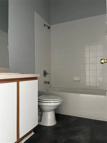 a bathroom with a bathtub and shower