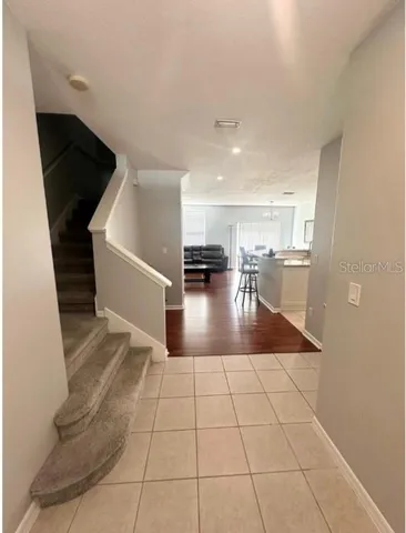 a view of entryway and kitchen